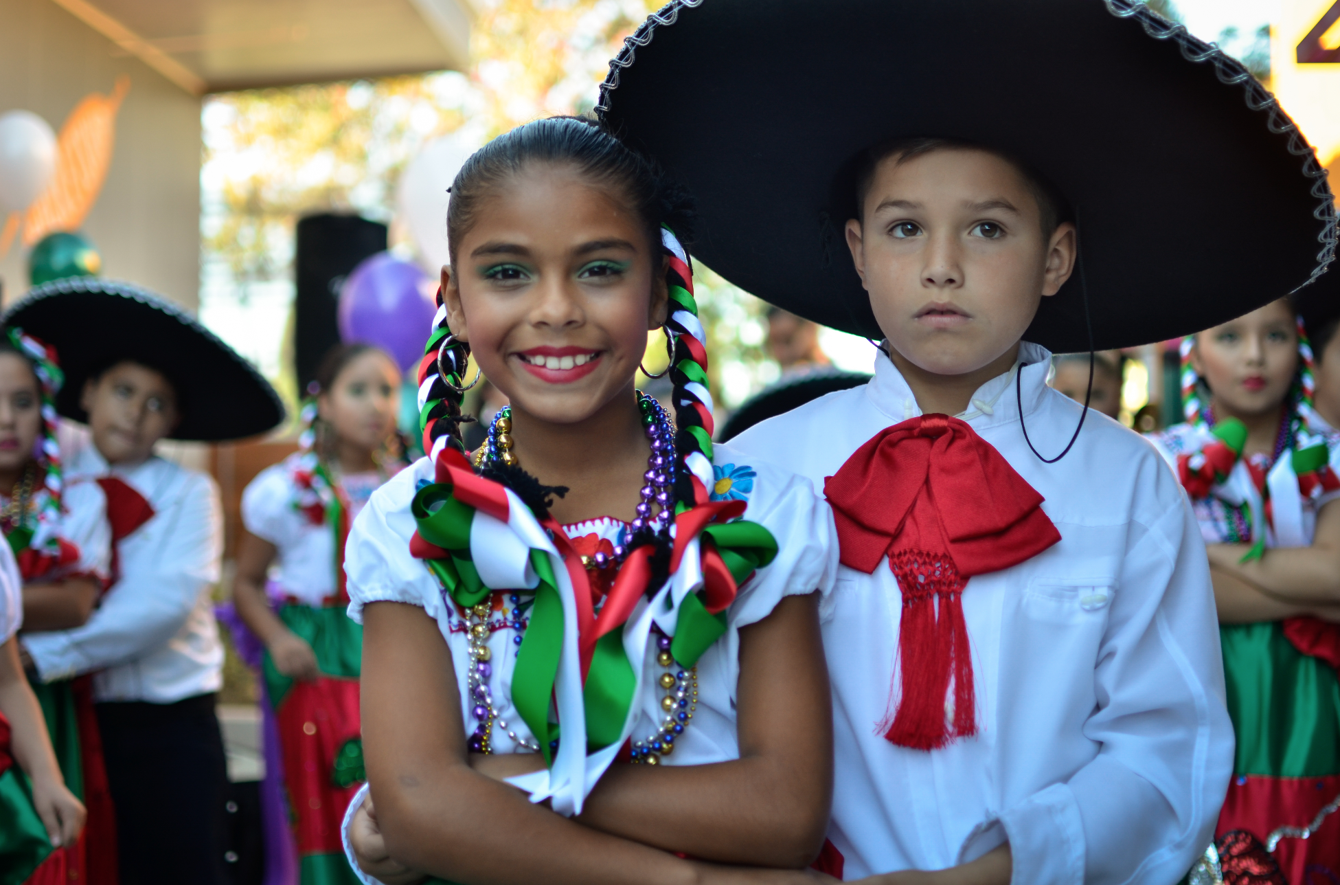 Rocketeers from Fuerza prepare perform the Jarabe Tapatío dance for crowd. 