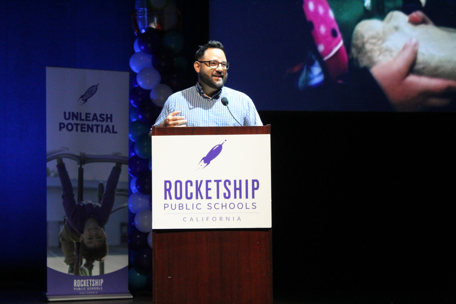 Man standing at a Rocketship podium