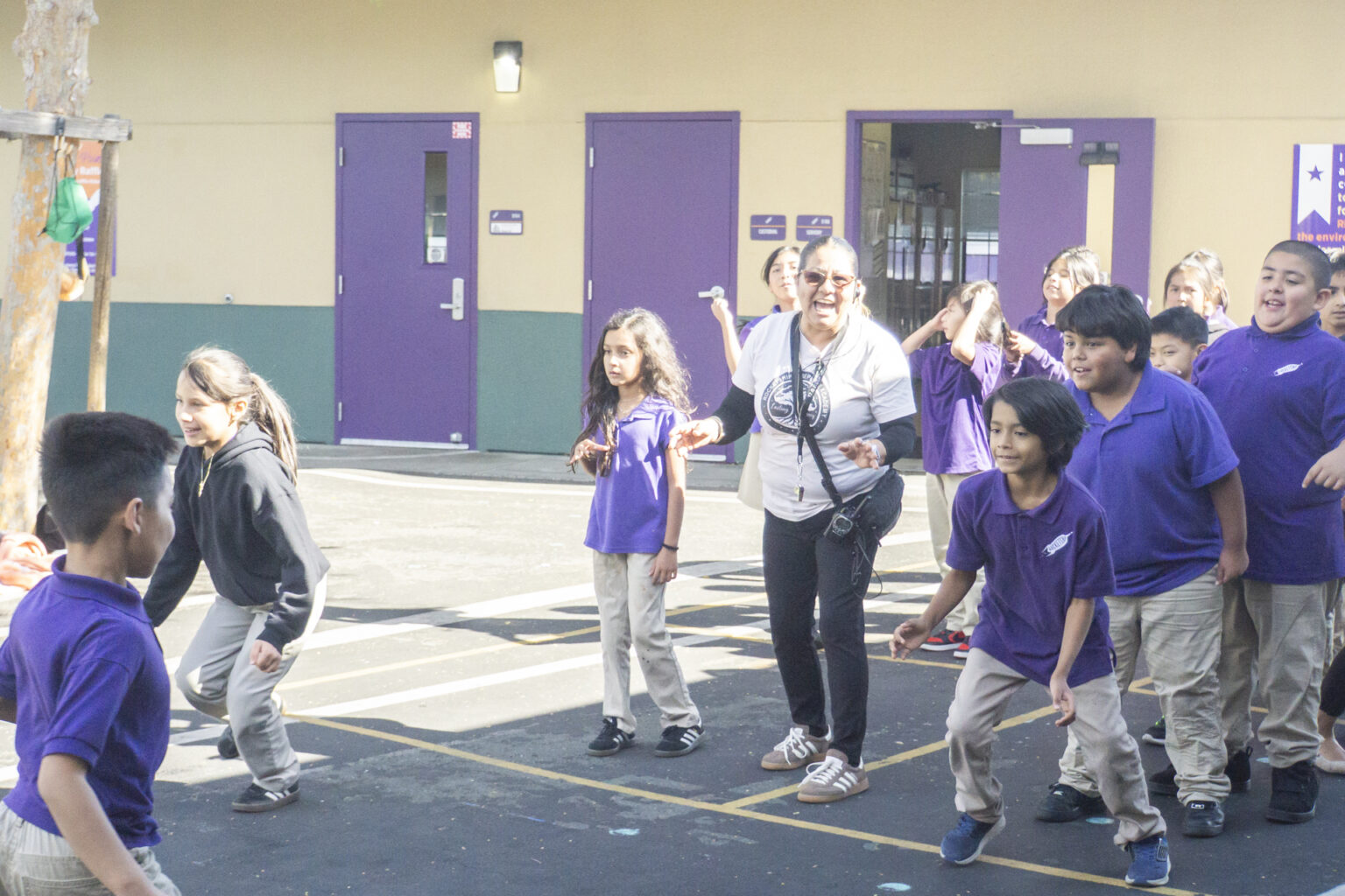 Staff and Rocketship kids in the playground